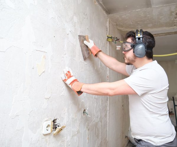 construction-worker-plastering-cement-on-wall-bui-2025-03-13-11-46-42-utc